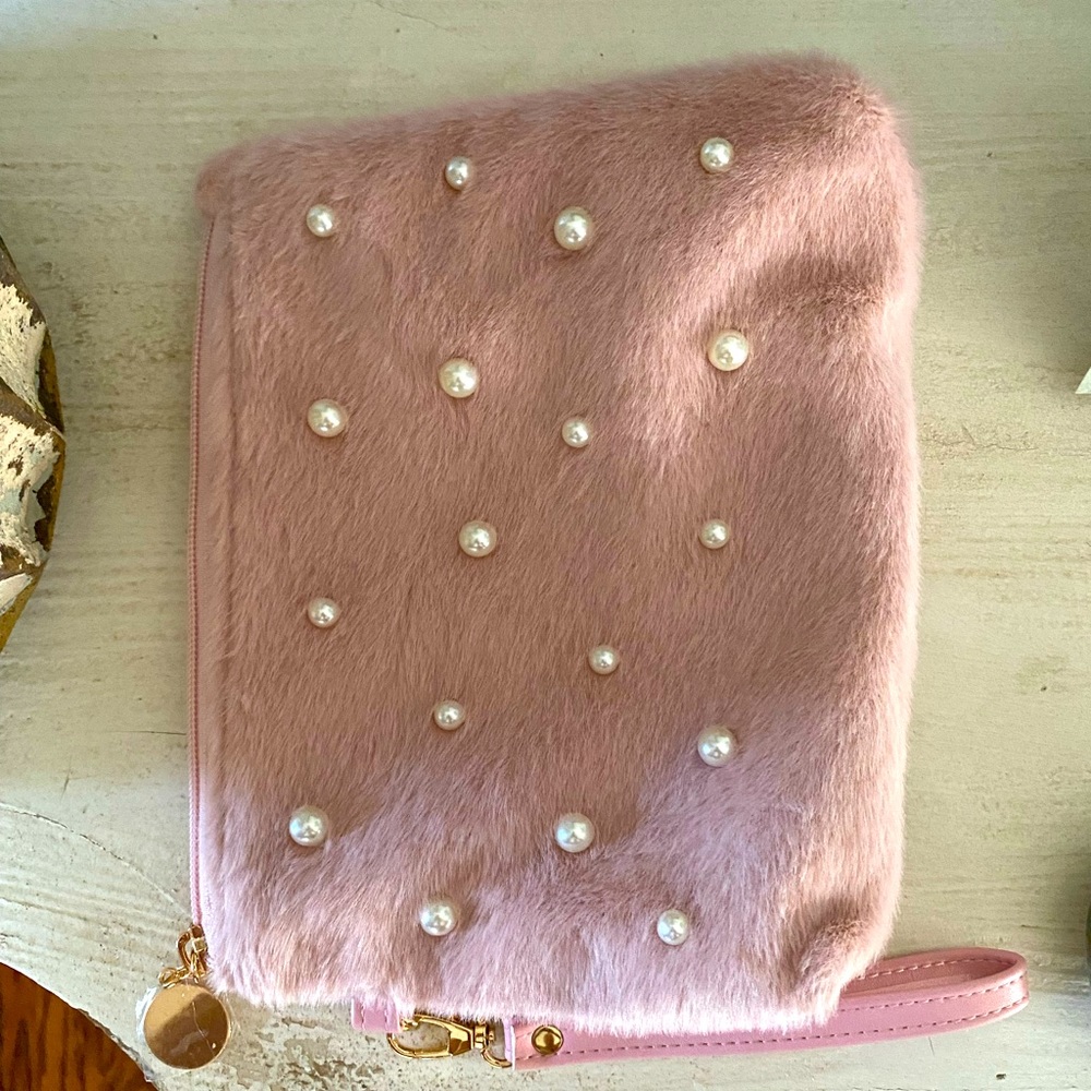 Cute pink zip wristlet new pearl accents on front side fuzzy all over!
